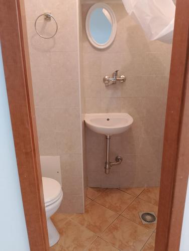 a bathroom with a toilet and a sink at Monolocale Portanuova in Pietragalla