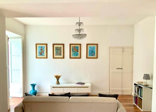 a living room with a couch and a table at Casa Marmelos Aurora in Beja