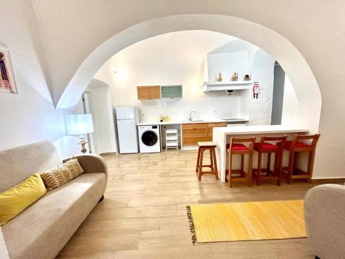 a living room with a couch and a table at Casa Marmelos Aurora in Beja