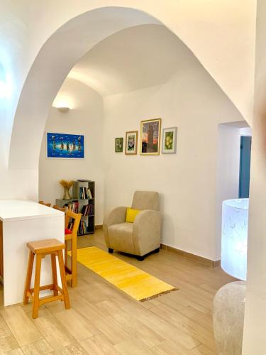 a living room with a couch and a chair at Casa Marmelos Aurora in Beja