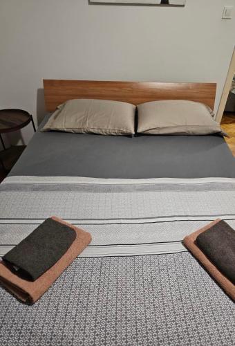 a bed with two pillows on top of it at Beachfront Dubrovnik Villa in Dubrovnik