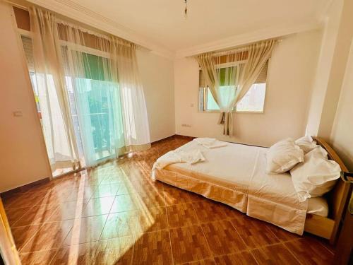 Ένα ή περισσότερα κρεβάτια σε δωμάτιο στο Villa 3 niveaux près de la mer