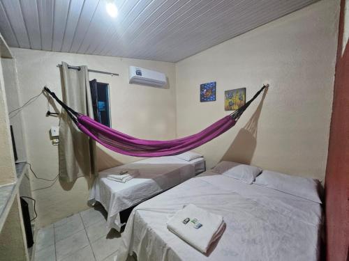 Postel nebo postele na pokoji v ubytování Pousada Mar de Iracema