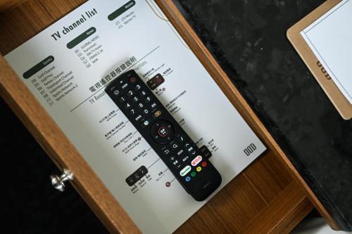 a remote control sitting on top of a box at OOD Hotel Taipei HangZhou in Taipei