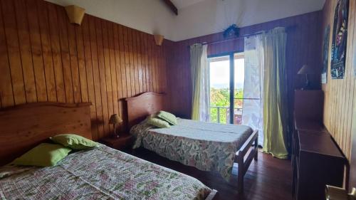 Postel nebo postele na pokoji v ubytování Cabañas Mana Ora