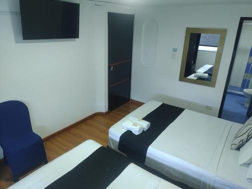 Postel nebo postele na pokoji v ubytování Hotel Bogotá la embajada