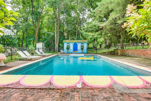 a swimming pool with a play house in a yard at Hudson Valley Estate on 4 Acres with Private Pool! in Nyack
