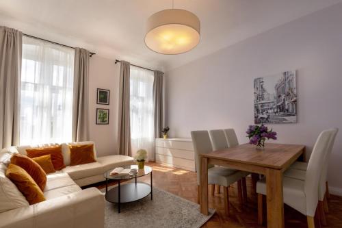 a living room with a couch and a table at Evita 3 in Gniezno