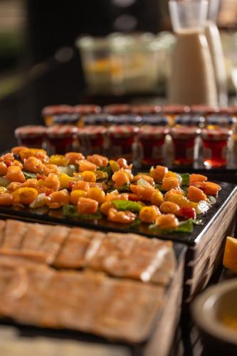 a bunch of trays of food on a table at Radisson Hotel Casablanca Gauthier La Citadelle in Casablanca