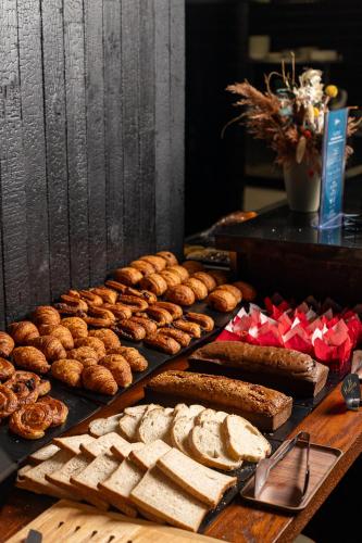 a display of bread and pastries on a table at Radisson Hotel Casablanca Gauthier La Citadelle in Casablanca