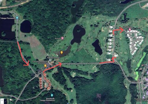 a map of a parking lot with red arrows at Caribbliss Suites in Lowlands