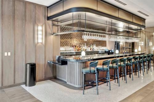 a bar with bar stools in a restaurant at 5108Great Penthouse, Bay view, in the heart of MIAMI in Miami