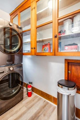 a kitchen with a microwave and a trash can at Amazing 3 bedroom home Steps, Airport, UofR, RIT, Strong in Rochester