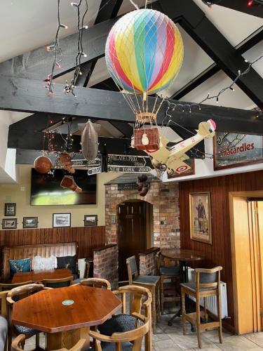 a hot air balloon hanging from the ceiling of a restaurant at The Carranstown Lodge in Duleek