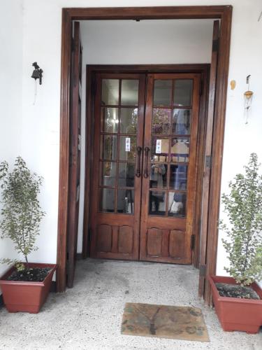an entrance to a house with a wooden door at VH Hotel V in Viña del Mar