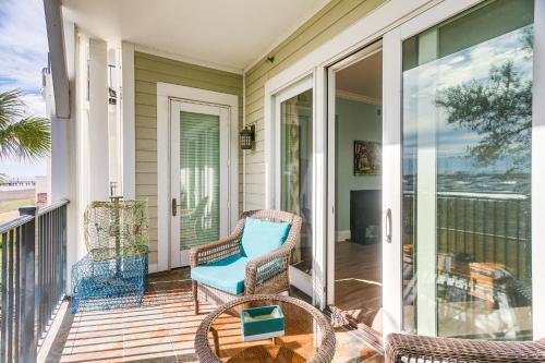 a porch with wicker chairs and a table at Breezy St Simons Hideaway with Waterfront Views! in Saint Simon Mills