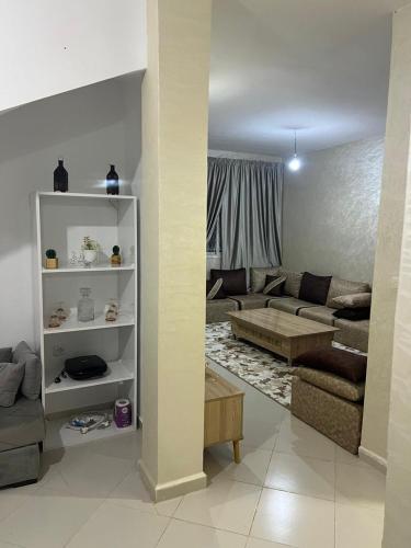 a living room with a couch and a table at Bait Khalij Dakhla 2 in Dakhla