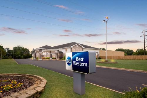 a best western sign in front of a house at Best Western Airport Inn in Moline