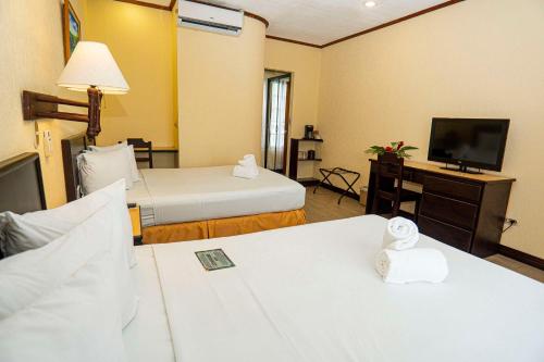 Letto o letti in una camera di Best Western Hotel & Casino Kamuk