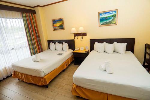 Letto o letti in una camera di Best Western Hotel & Casino Kamuk