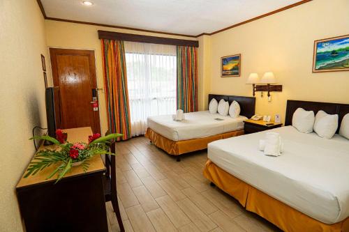 Letto o letti in una camera di Best Western Hotel & Casino Kamuk