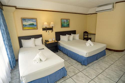 Letto o letti in una camera di Best Western Hotel & Casino Kamuk
