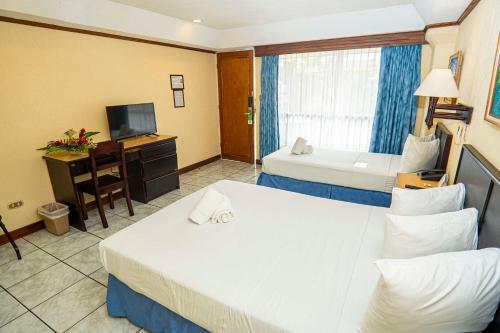 Letto o letti in una camera di Best Western Hotel & Casino Kamuk