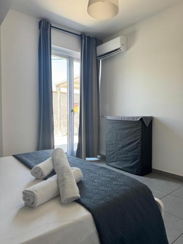 Postel nebo postele na pokoji v ubytování Riposto Etna Taormina Mare