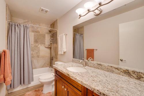a bathroom with a sink and a toilet and a shower at Flagstaff Townhome with Grill about 3 Mi to Downtown! in Flagstaff