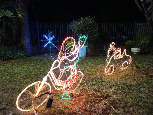 a group of lights on a bike in the grass at Light House Lodge in Bela-Bela