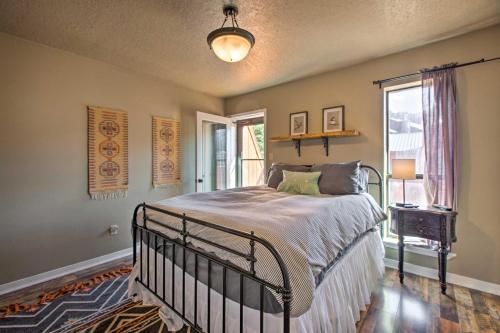 a bedroom with a bed and a window at Modern Mountain Retreat with Views Ski, Golf and Hike in Angel Fire