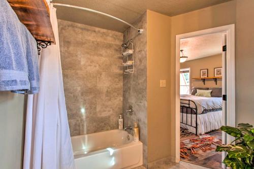 a bathroom with a shower and a bath tub at Modern Mountain Retreat with Views Ski, Golf and Hike in Angel Fire