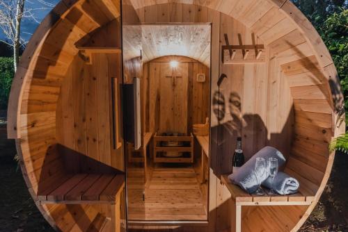 a circular wooden sauna with a circular room in the middle at Expansive Luxury Country Escape in Prebbleton