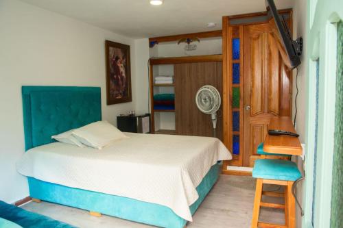Postel nebo postele na pokoji v ubytování Habitación La Amelia