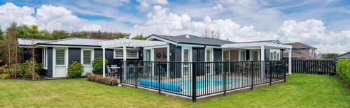 a house with a swimming pool in the yard at Oasis on Okaia in Kinloch