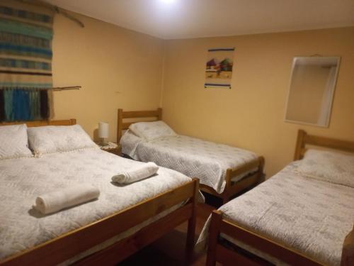 En eller flere senge i et værelse på Cabaña Patagonia Rustica