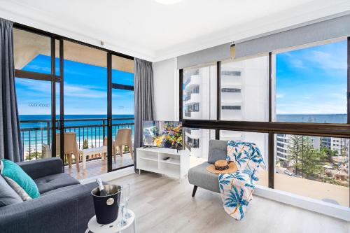 a living room with a view of the ocean at Beachcomber Resort - Official in Gold Coast