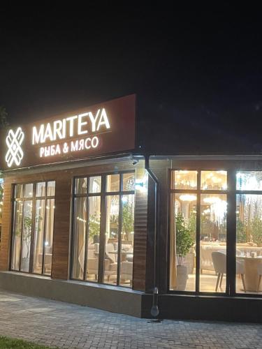 a store with a sign that reads marfilva pasta and moco at квартира в ЦО Радуга Иссык Куль9 Raduga Issyk Kul in Chon-Sary-Oy