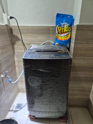 a cpu sitting on a floor with a bag of chips at Lydia's Residences in Boracay