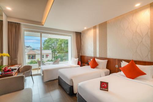 Una cama o camas en una habitación de Seashells Phu Quoc Hotel & Spa