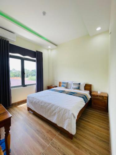 Postel nebo postele na pokoji v ubytování Hoàng Đô Hotel