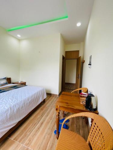 Postel nebo postele na pokoji v ubytování Hoàng Đô Hotel
