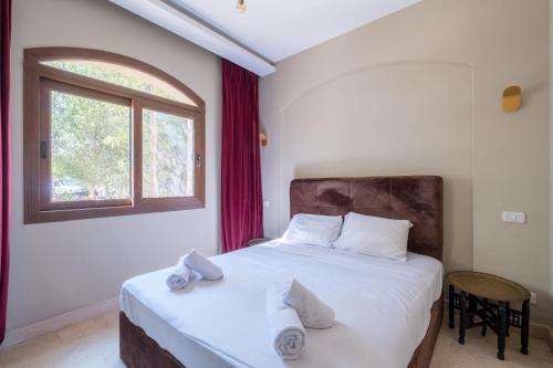 Postel nebo postele na pokoji v ubytování El Gouna 1 Bedroom Apartment west golf ground floor