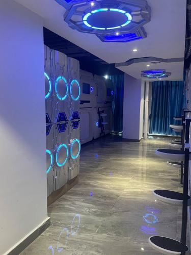 a room with blue lights on a wall at SENNA SUNSHINE INTERNATIONAL HOTEL in Sihanoukville