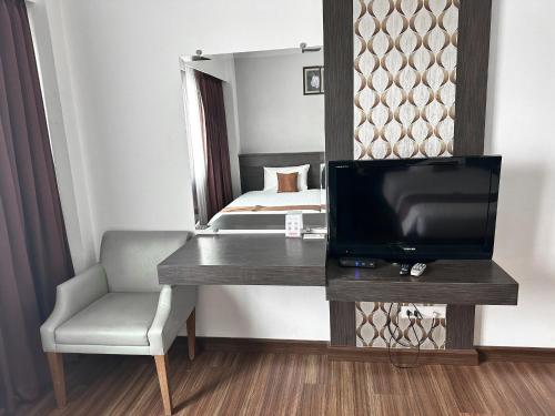 Akelada Hotelにあるテレビまたはエンターテインメントセンター