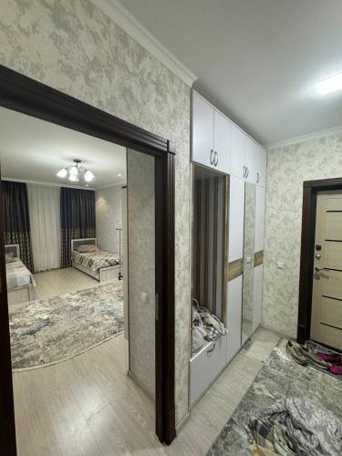 a living room with a room with a bedroom at Bahor Yunusabad Lux in Tashkent