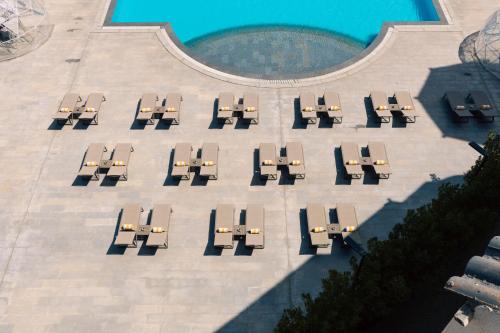 an overhead view of a group of tables and chairs at Palma Hotel in Port Said