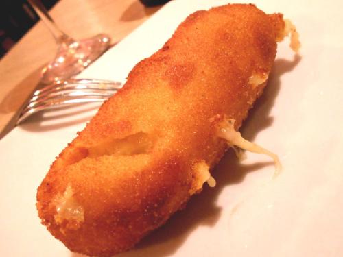 a piece of food on a white plate with a fork at Tenuta Montelaura in Forino