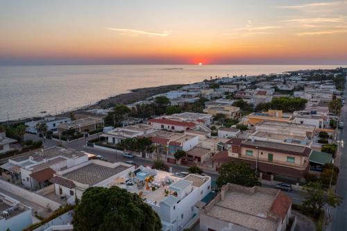 an aerial view of a city with the ocean at Terrazza e Conchiglie in Torre Suda