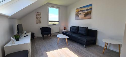 Ruang duduk di Ferienhaus Watt`n Blick - nah an der Nordsee
